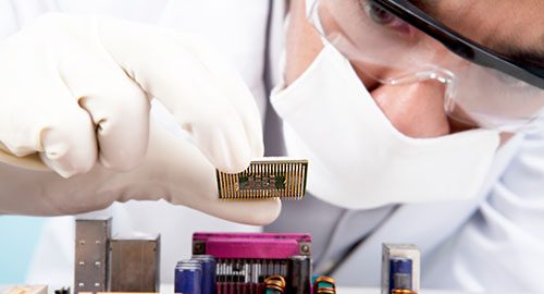 Scientist installing a CPU. Technology is one of the many applications for deuterium oxide